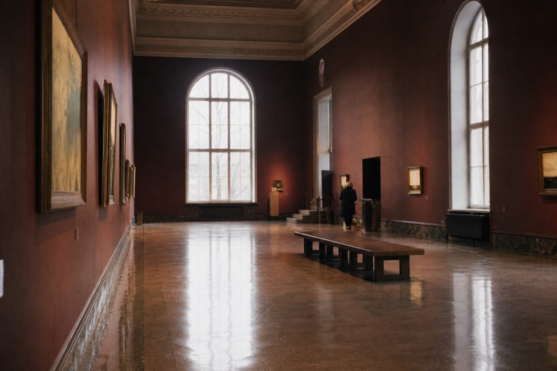 Quiet townhouse gallery in central Copenhagen with visitors browsing a free permanent collection